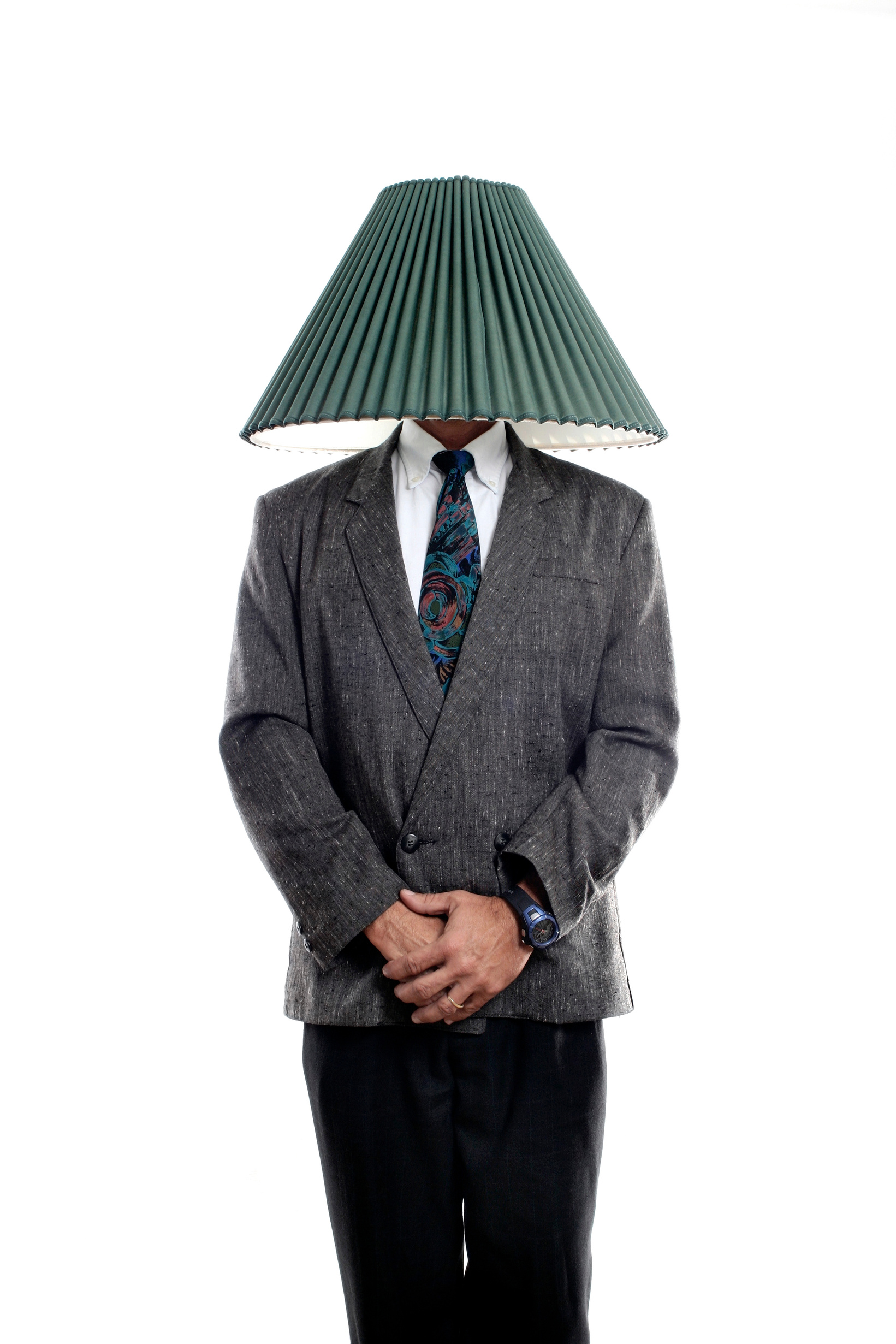 Businessman with a lamp shade covering his head
